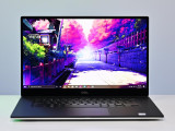 Refurbished This image displays a Dell XPS 15 7590 laptop open at an angle showing its vibrant 16:9 display with artwork of a cherry
